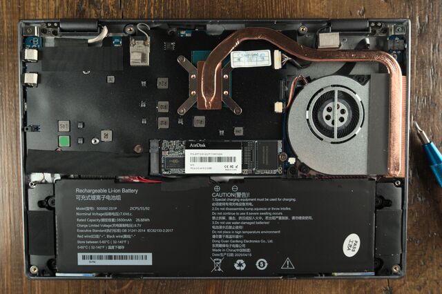 Chuwi Minibook with back cover removed, exposing battery and NVMe drive